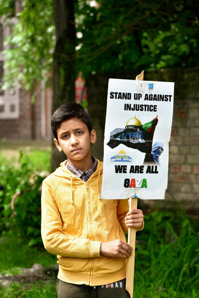 boy holding political placard about Gaza on 29th April 2022 against Israel 